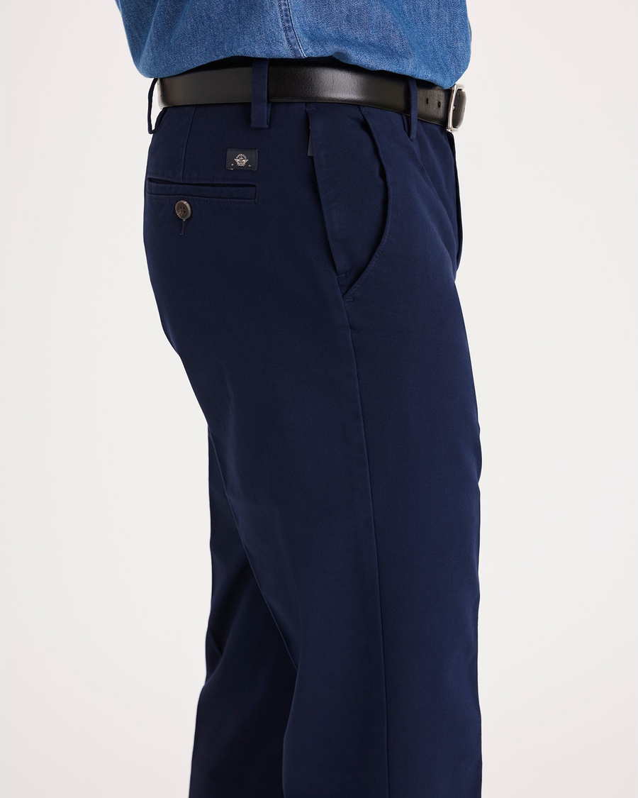 Side view of model wearing Pembroke Workday Khakis, Straight Fit.